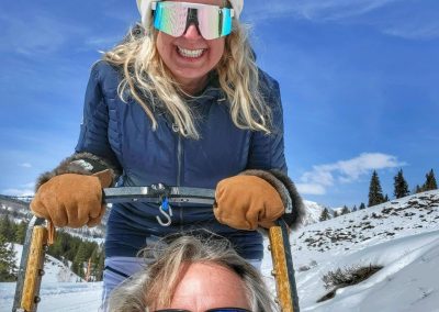 Britt and her husband Bill in a snowy mountain range